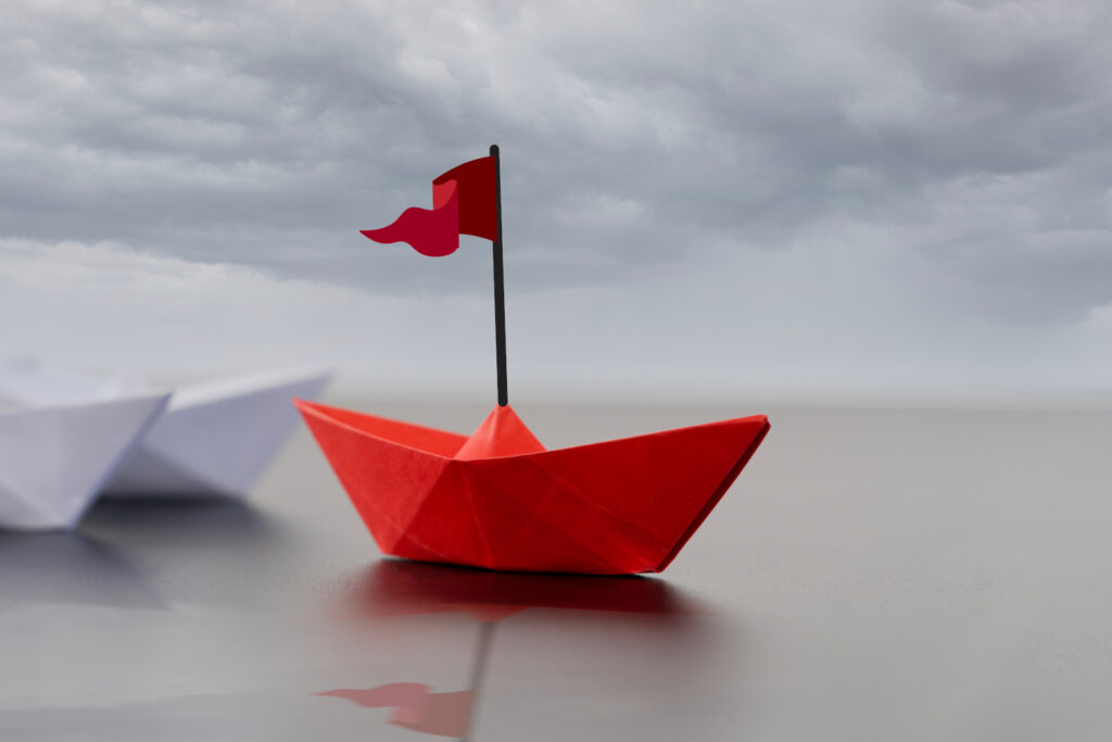 leadershipconceptwithpaperboats-setofcolorfulorigamiships